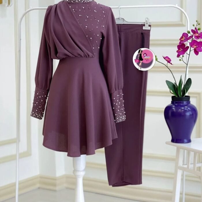 Lilac two-piece set with pearl embellishments on the neckline, sleeves, and bodice, paired with straight-leg trousers.